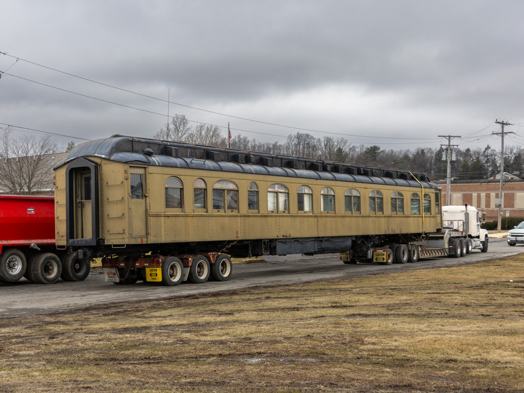 a train is parked on the side of a truck