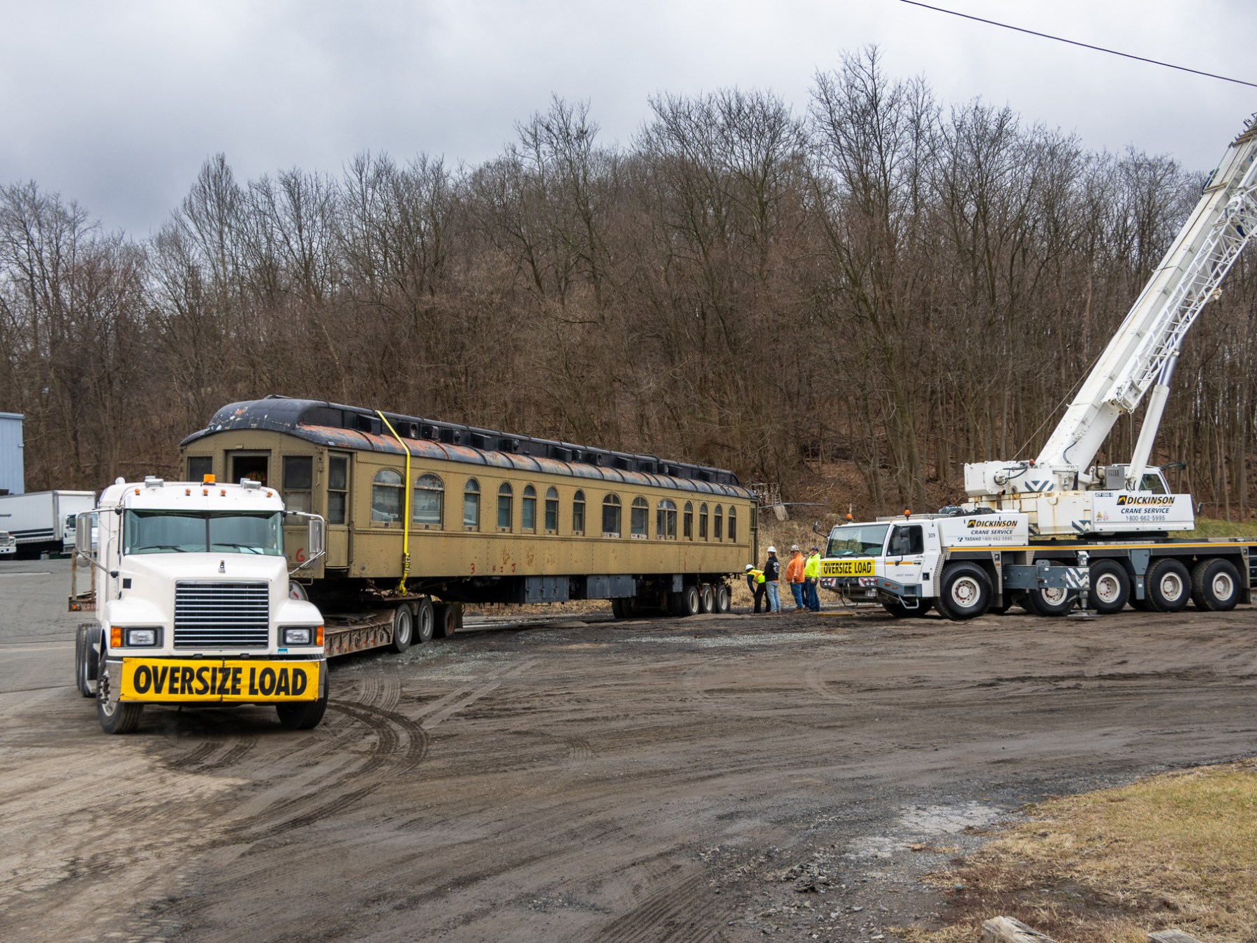 a truck driving down a dirt road