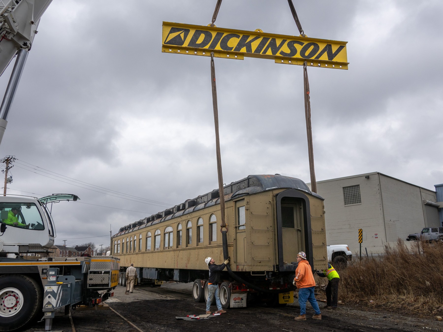 a crane standing in front of a sign