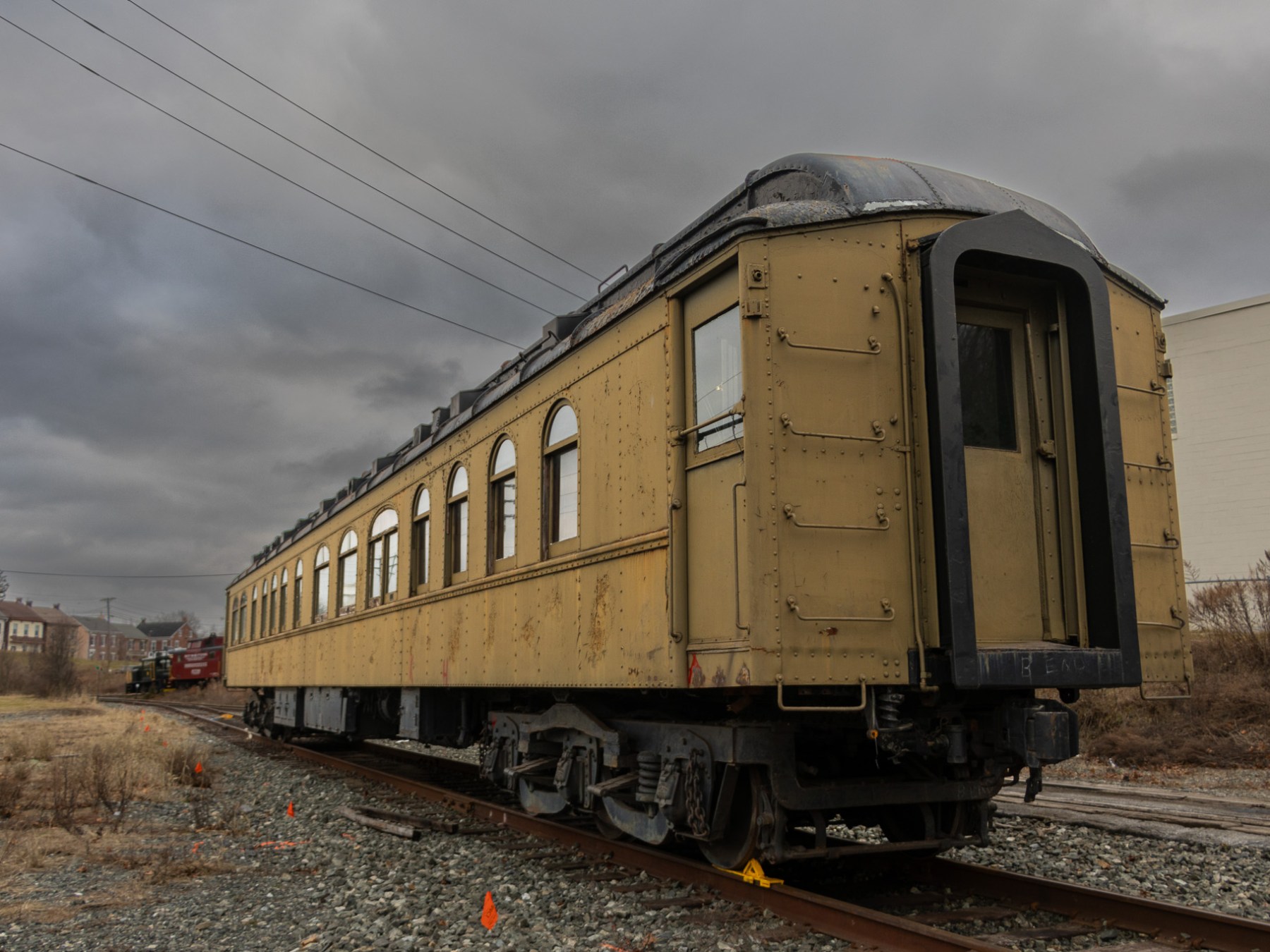 a train is parked on a dirt track
