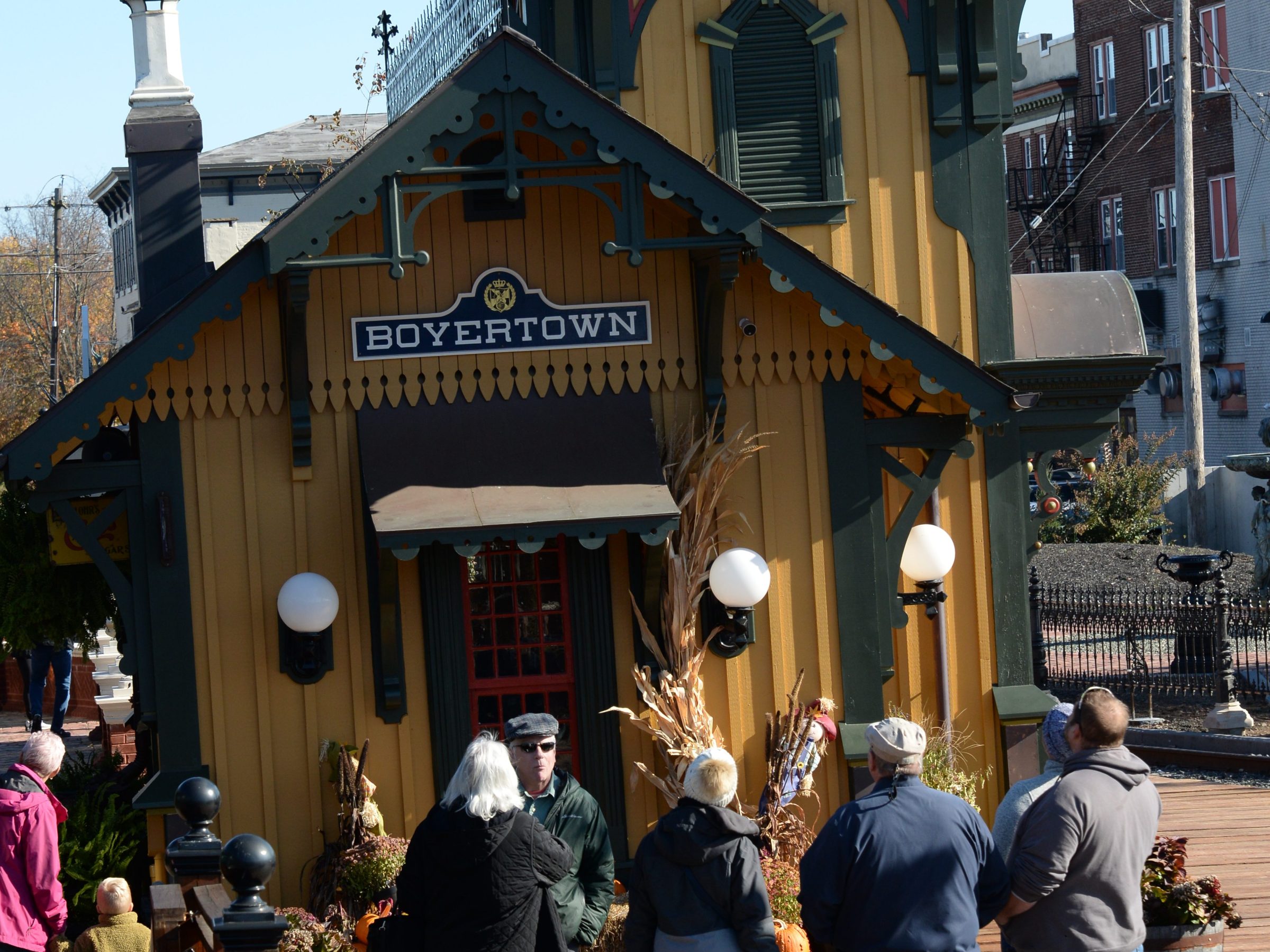 a group of people standing in front of a building