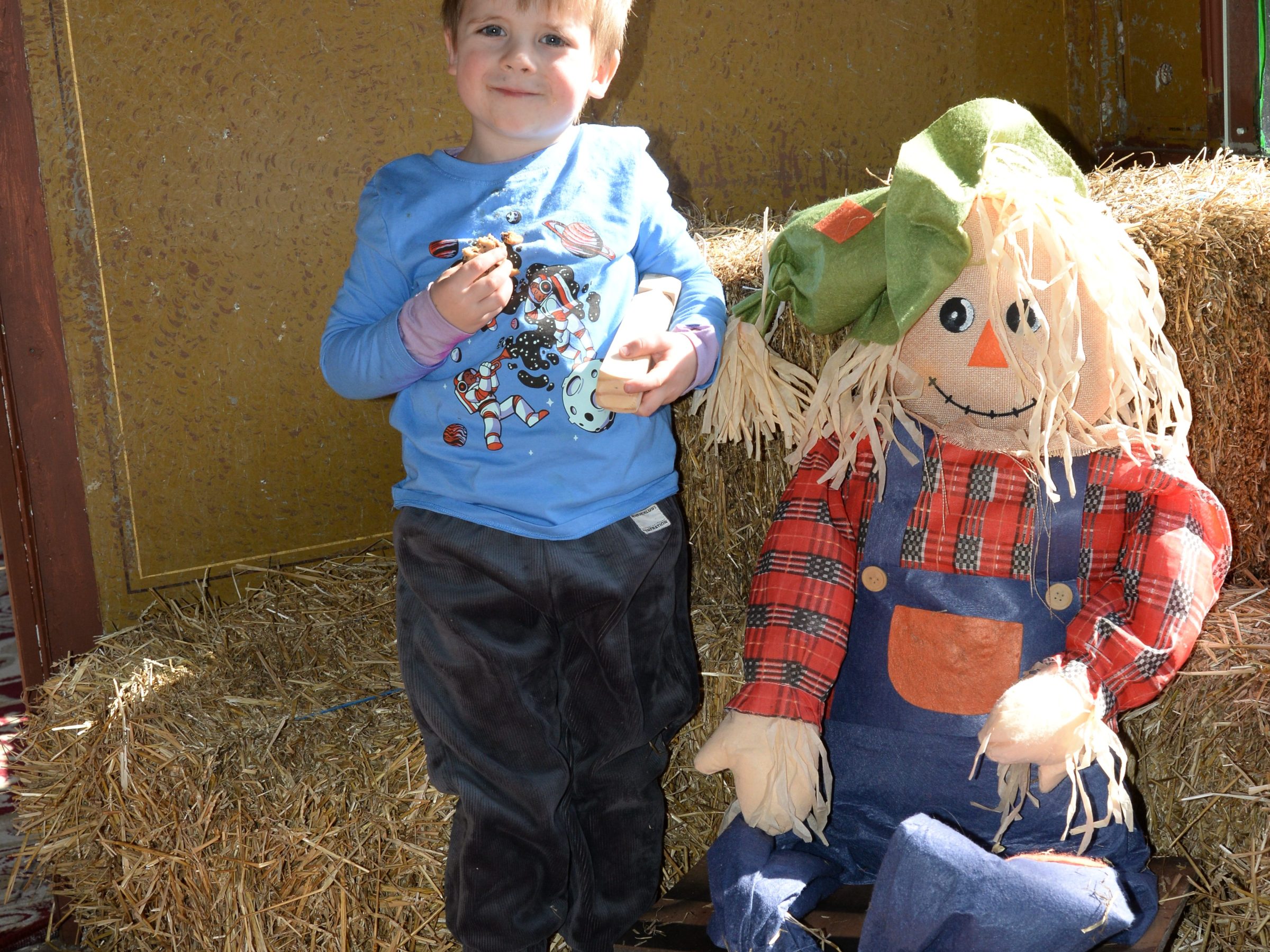 a small child sitting on a bed