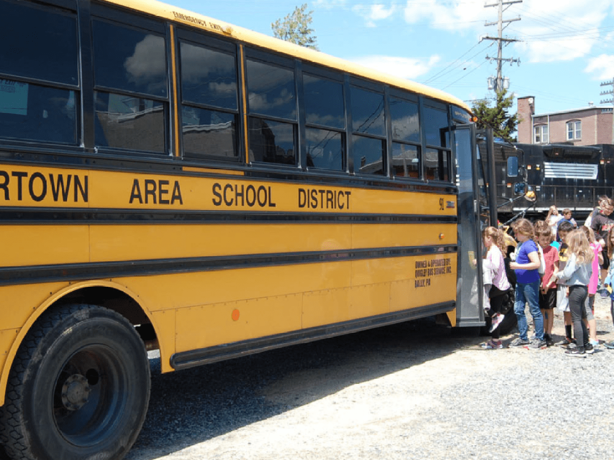 a close up of a school bus parked in a parking lot