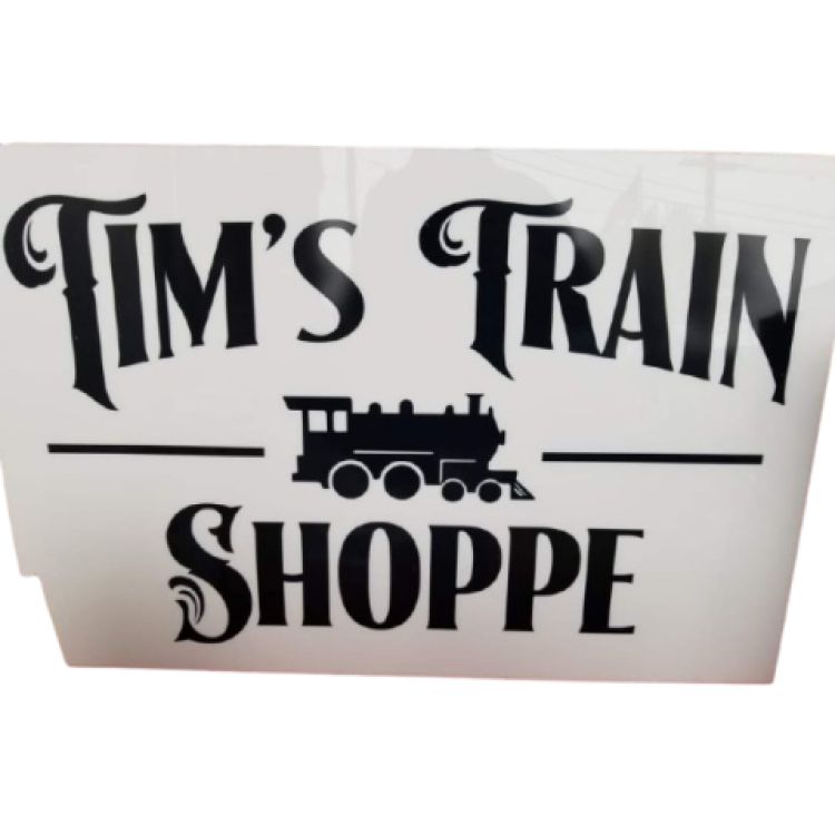 Sign reads 'Tim's Train Shoppe' with a train graphic.